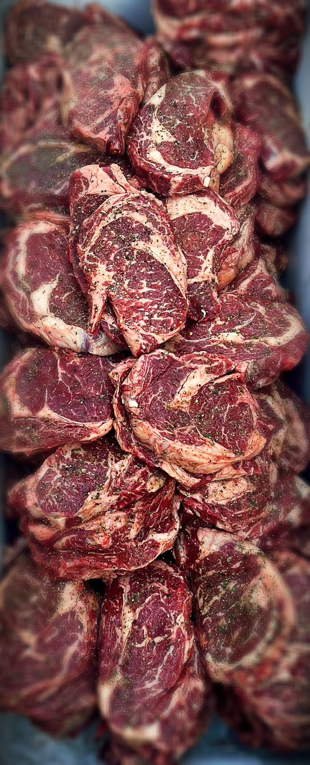 well-marbled, all natural black angus rib eyes